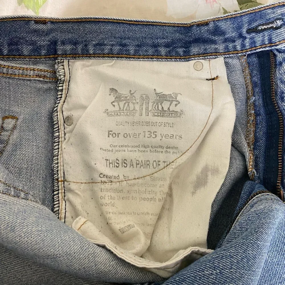 Levi's 505 Light Blue Straight Leg Jeans with Distressed Details
